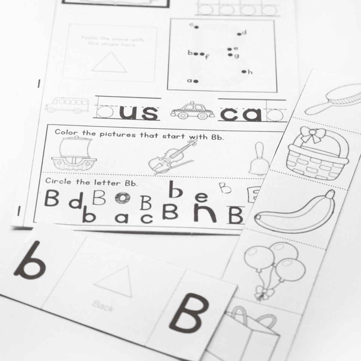 black-and-white alphabet interactive notebook pages feature letter b activities including letter tracing, beginning sound pictures, word completion, circling uppercase and lowercase bb, and cut-and-fold alphabet pieces. children practice phonics, handwriting, letter recognition, vocabulary, and fine motor skills while completing the interactive notebook page.