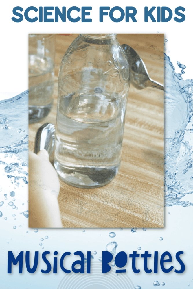 close up image of a child using two spoons to tap on a glass bottle.