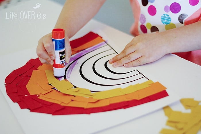this rainbow craft for preschoolers is great for working on fine motor skills as the kids cut & paste their rainbow together!