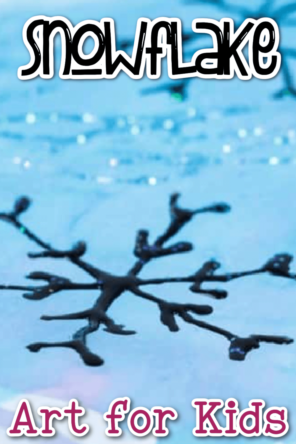 Close up of a black glue snowflake and glitter on a blue background.