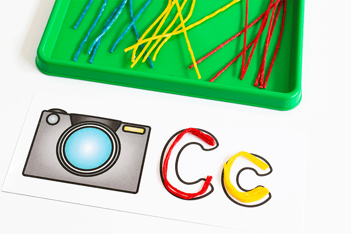 use wikki stix to create cletters of the alphabet on alphabet outline mats for preschool literacy centers.