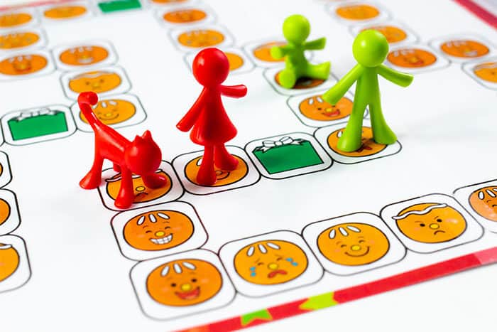 gingerbread emotions board game for preschoolers. learn about emotions through a free printable gingerbread themed game.
