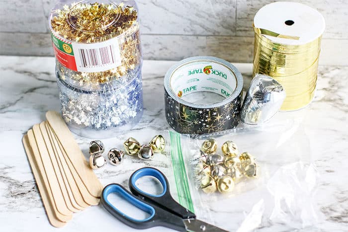 supplies for the popsicle stick new year's noisemaker craft for kids
