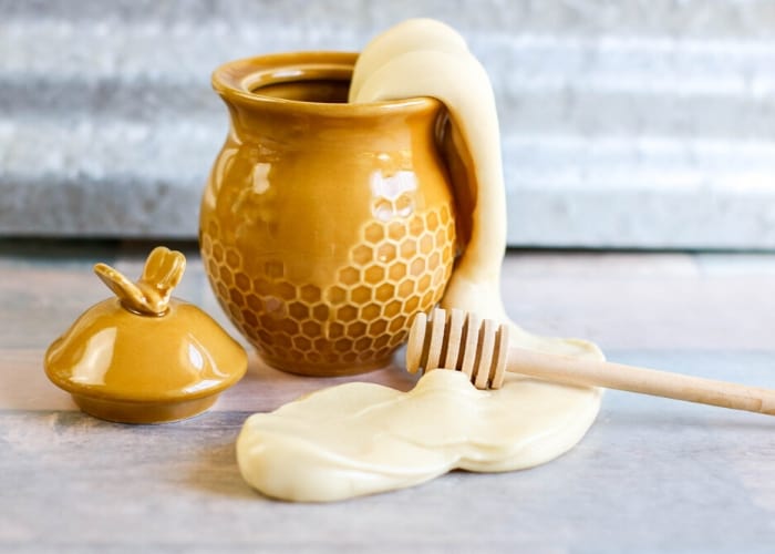 – Life Over C's Honey Slime in a ceramic honey pot