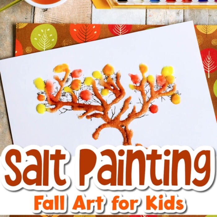 square photo of fall tree salt painting with glue and salt lines in the shape of a tree colored with brown, orange and yellow watercolors