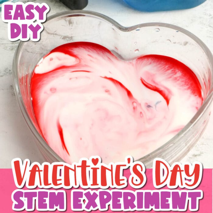 easy diy valentine's day stem experiment magic milk science experiment in a heart shaped bowl with red food coloring.