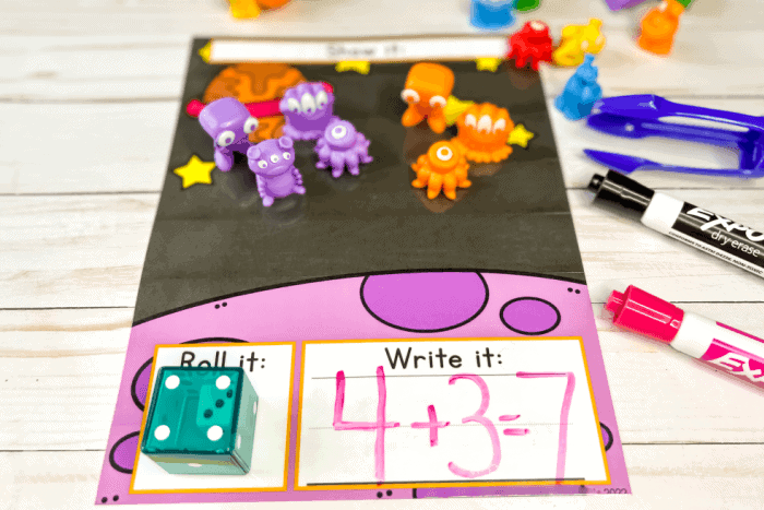a space theme roll and count dice game for addition.