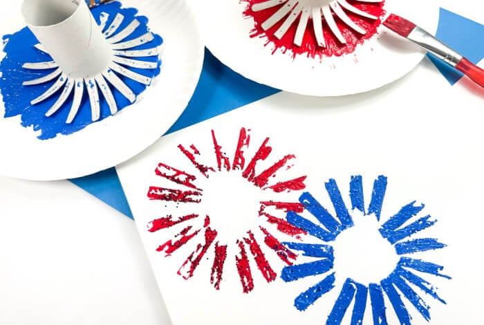 blue and red fireworks on white paper.