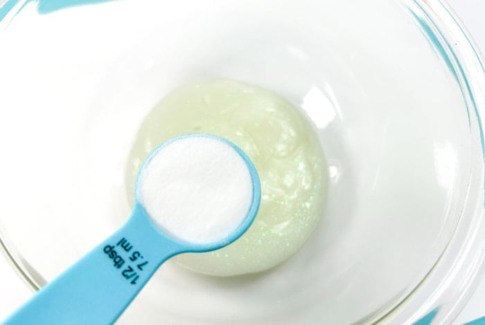 add baking soda to the mixture of contact solution and glow in the dark glue.