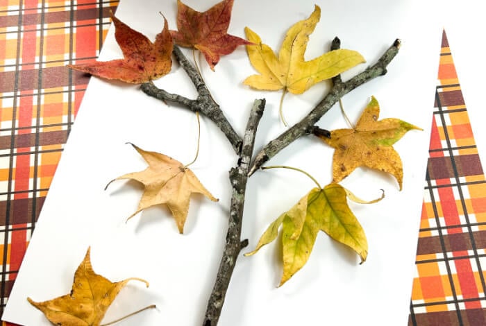 Make a Super Easy Fall Tree Craft for Preschoolers 13 fall leaf craft for kids using sticks and fall leaves to create a fall tree craft