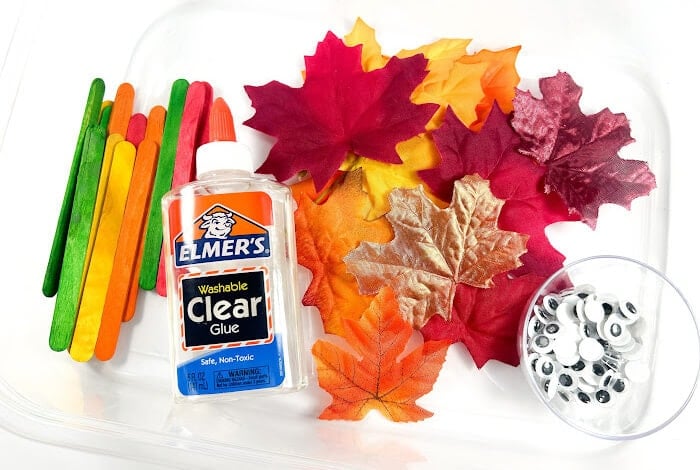 supplies for a fall leaf puppet craft.