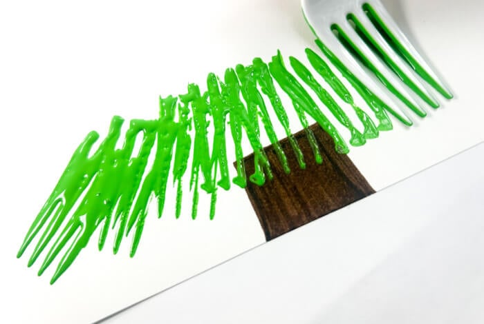 Fun Christmas Tree Fork Painting Craft for Kids 19 using a simple plastic fork to paint the bottom of a christmas tree on white paper