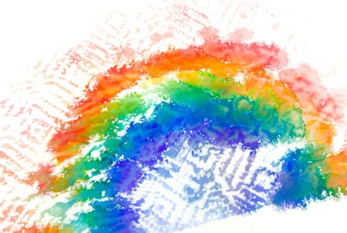 Magic Rainbow Science Experiment for Kids 19 overhead view of a rainbow imprint on a piece of cardstock paper.