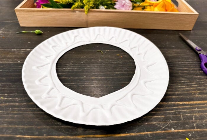 a paper plate with the center cut out and glue along the outside edges.