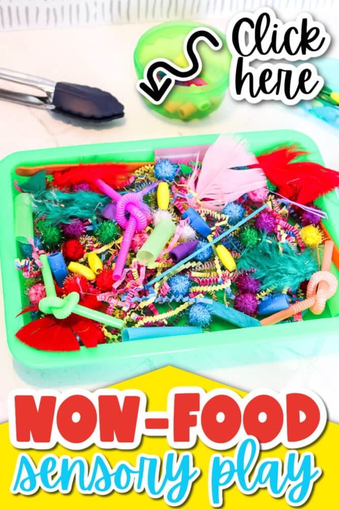 colorful feathers, craft sticks, straws, pom poms, and other materials are in a sensory bin.