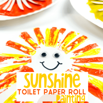 overhead image of a sun painting made from paint and toilet paper rolls.