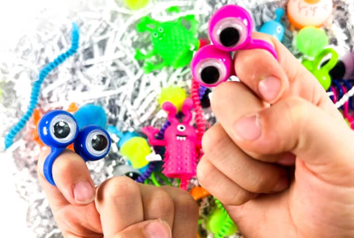 someone is playing with items in the monster sensory bin.