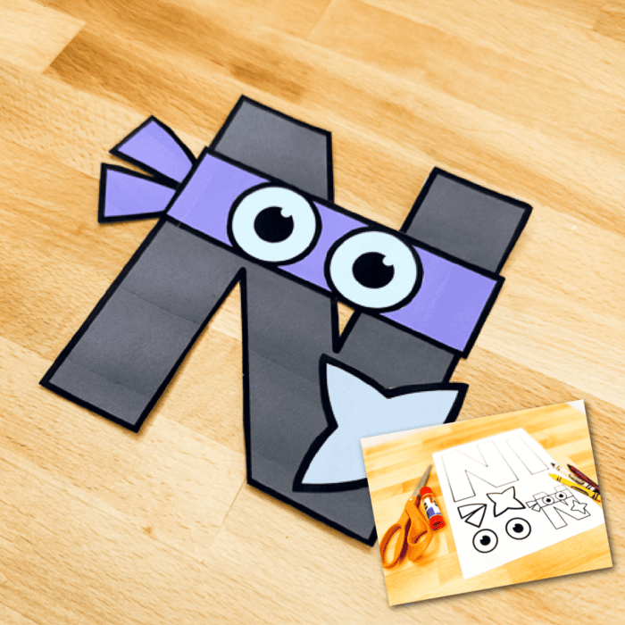 completed uppercase letter n craft: n is for ninja with black letter n wearing a purple eye mask and holding a throwing star