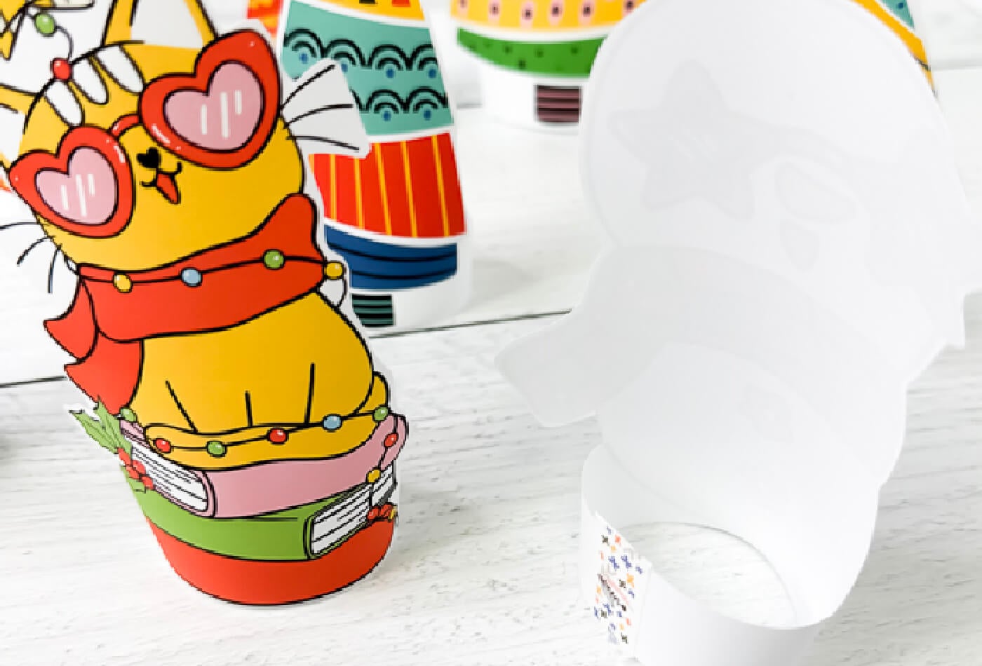 close up photo demonstrating how to create the circle base for a set of free printable Christmas paper dolls for preschoolers