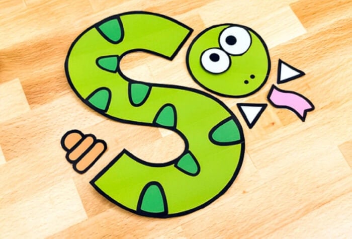 the pieces of a "s is for snake" alphabet craft cut out and ready to be glued together. 