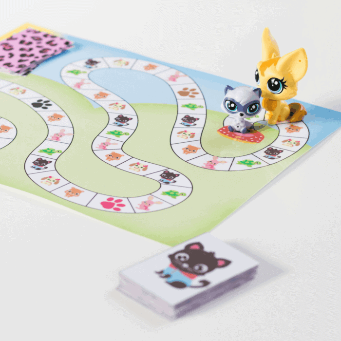 pet theme activities for preschool and kindergarten featuring a colorful pet board game with animal pictures, playing cards, and cat game pieces.