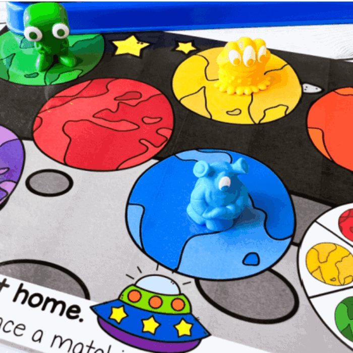 space theme activities for preschool and kindergarten featuring colorful planets, alien manipulatives, a spaceship, and a matching activity.