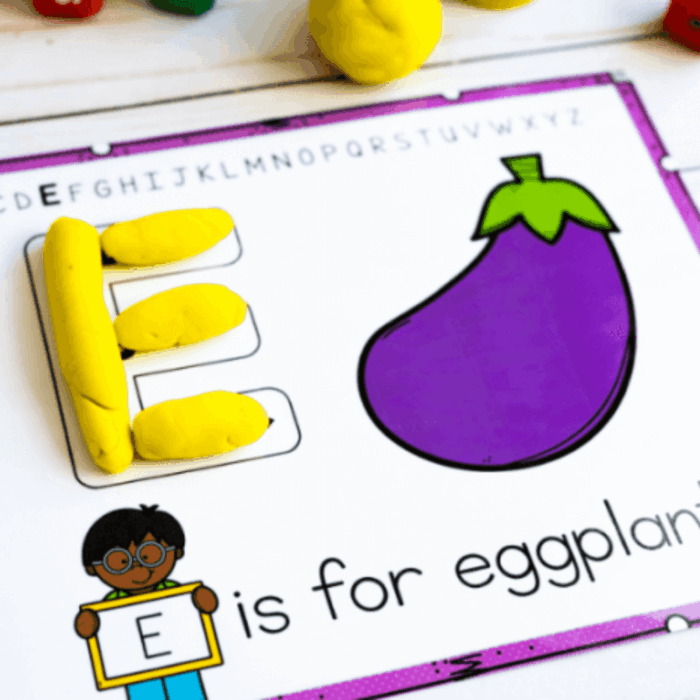 food theme activities for preschool and kindergarten featuring a hands-on alphabet activity with yellow dough shaped into the letter e beside a large eggplant picture and the phrase “e is for eggplant.”